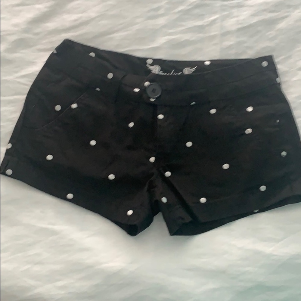 Black shorts with white polka dots